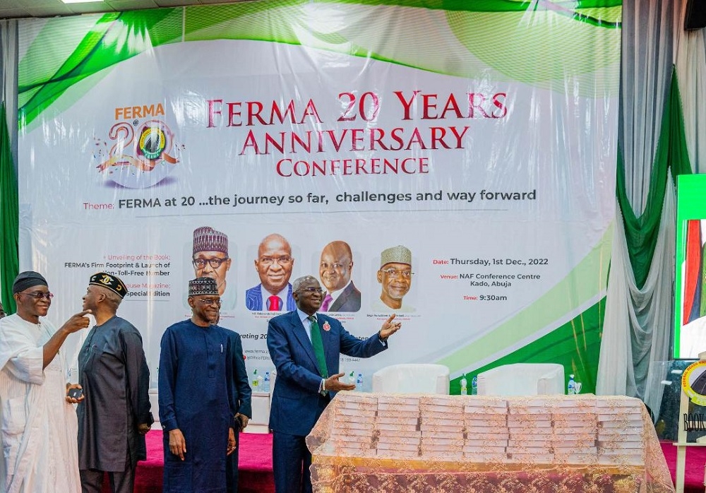 Representative of the President and Hon. Minister of Works and Housing, Mr Babatunde Fashola,SAN (right), Managing Director/CEO, Federal Roads Maintenance Agency (FERMA), Engr. Nurudeen Rafindadi (2nd right) and Chairman, Senate Committee on Federal Roads Maintenance Agency (FERMA), Senator Gershom Bassey (2nd left) and former Chairman, Governing Board Federal Roads Maintenance Agency (FERMA), Engr. Ezekiel Adeniji (left) during FERMA&#039;S 20th  Anniversary Conference , public presentation of the Book titled, &quot;FERMA&#039;s Firm Footprints in National Road Infrastructure Maintenance&quot; and Launch of FERMA&#039;s Short Code  at the NAF Conference Centre, Kado, Abuja on Thursday, 1st December 2022. 