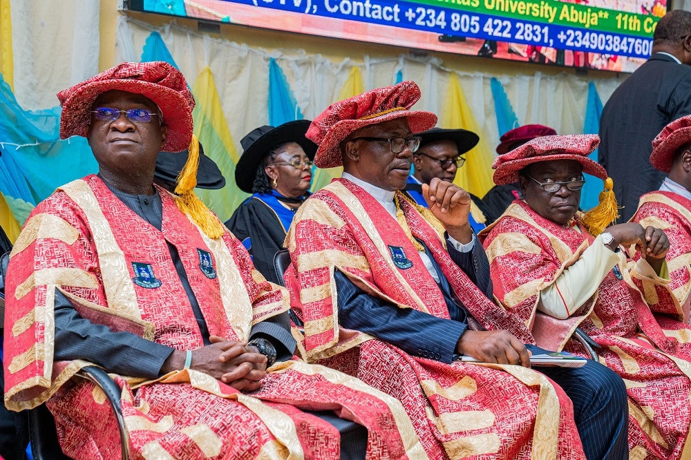 Hon. Minister of Works and Housing and Guest Lecturer,Mr Babatunde Fashola,SAN (left), the Founder, the Kukah Centre, Bishop Mathew Hassan Kukah (right) and Vice Chancellor , Veritas University Abuja, Prof. Hyacinth Ichoku (middle) during  the Veritas University 11th Convocation Lecture on the theme, &quot; Mind, Mindset and State of Mind,&quot; and Conferment of Honorary Doctorate Degree (Honoris Causa) Ceremonies at the Veritas University Multipurpose Hall, Bwari Area Council , Abuja on Saturday, 3rd December 2022  