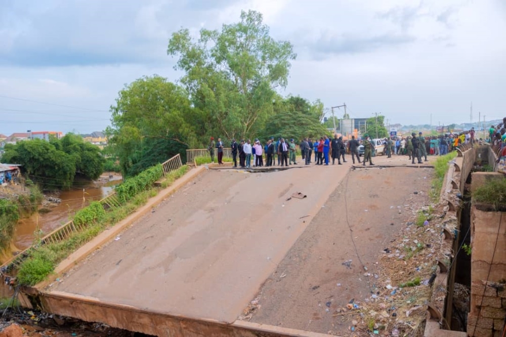 The Honourable Minister of Works, Sen. Engr David Umahi and the Executive Governor, Enugu State, H.E Peter Mbah during the inspection of the commencement of palliative works at the collapsed bridge at New Artisan Flyover/NNPC Mega Station along Enugu/PH Expressway , Enugu State.